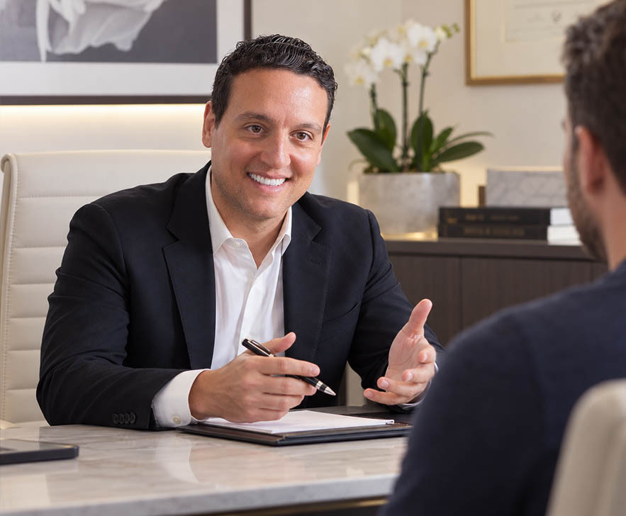 Dr. David Shokrian discussing penile enhancement options with an adult male patient during a private NYC consultation