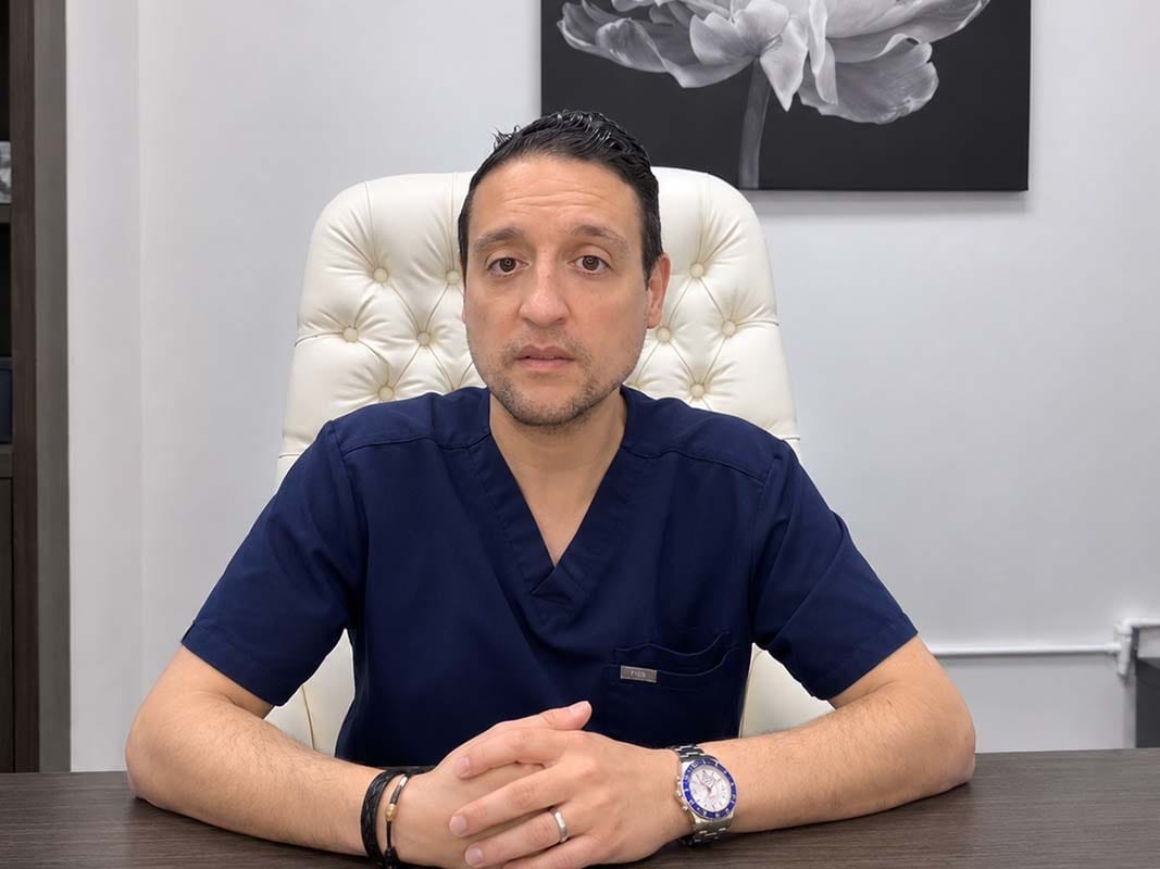 Dr. Shokrian, plastic surgeon, in a clinical treatment room for PRP P-Shot and penile rejuvenation care.