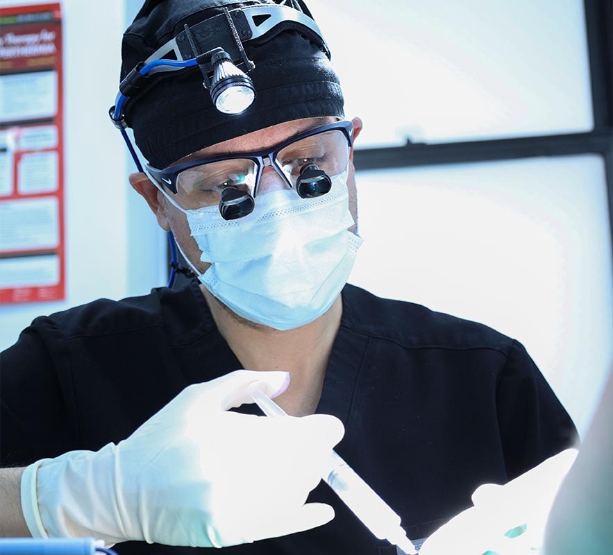 Dr. David Shokrian performing a medical procedure at Penile Enhancement Center of New York.